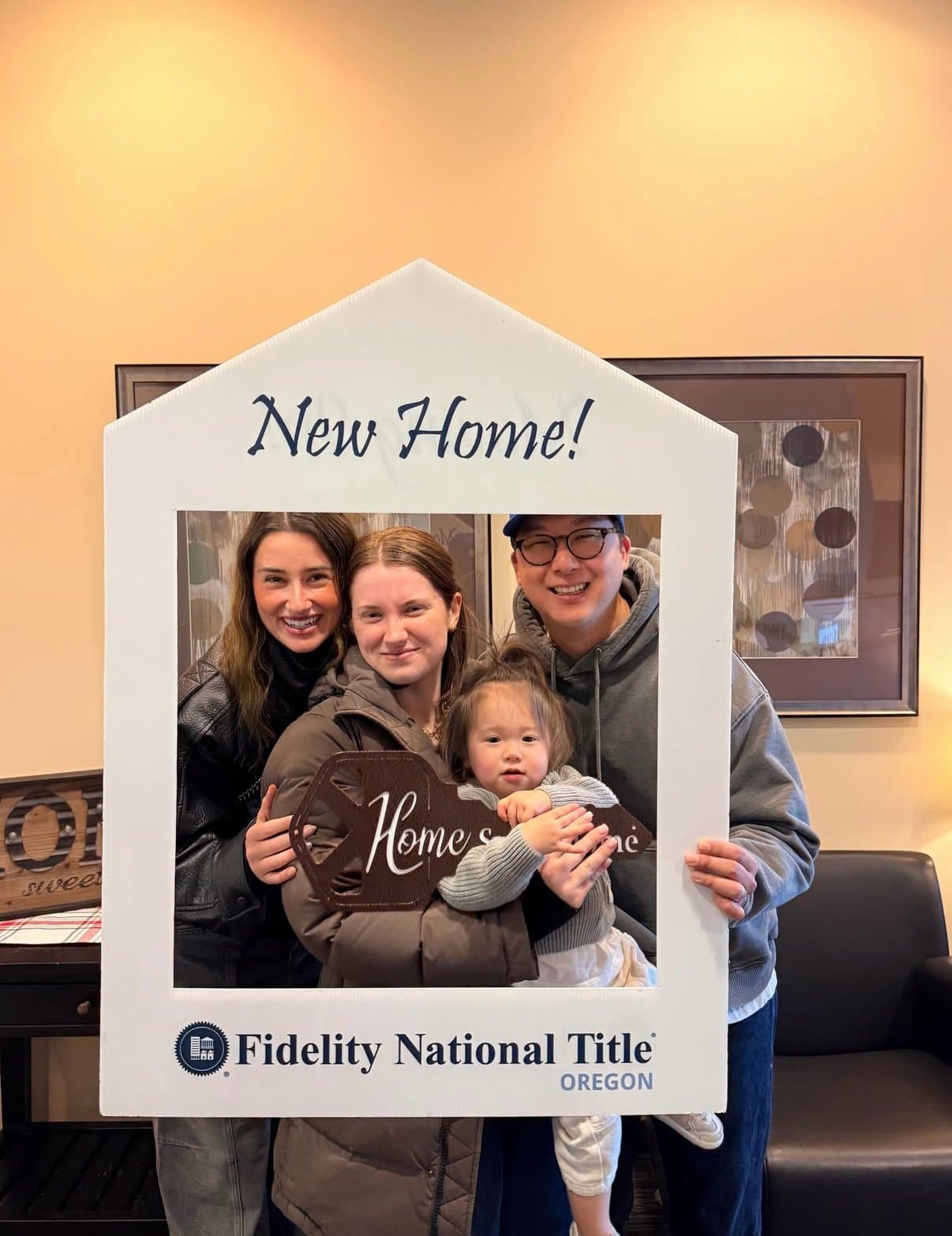Hannah Wolfe with clients celebrating their new home at closing