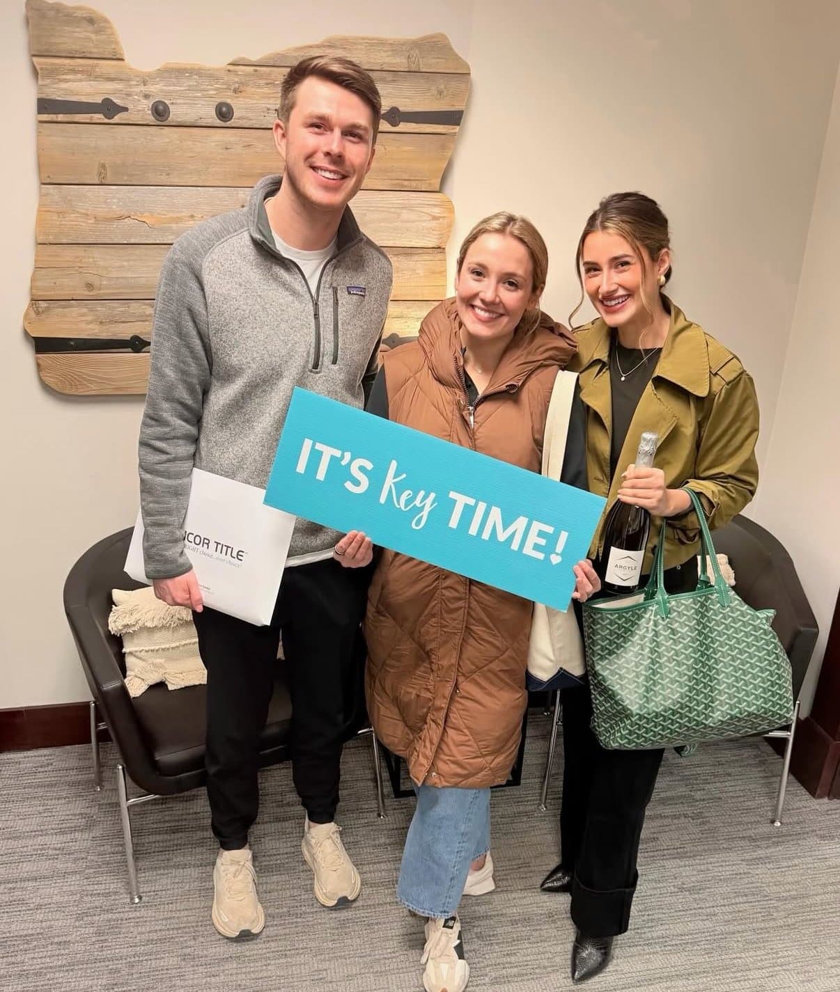 Happy couple with Hannah Wolfe on key day